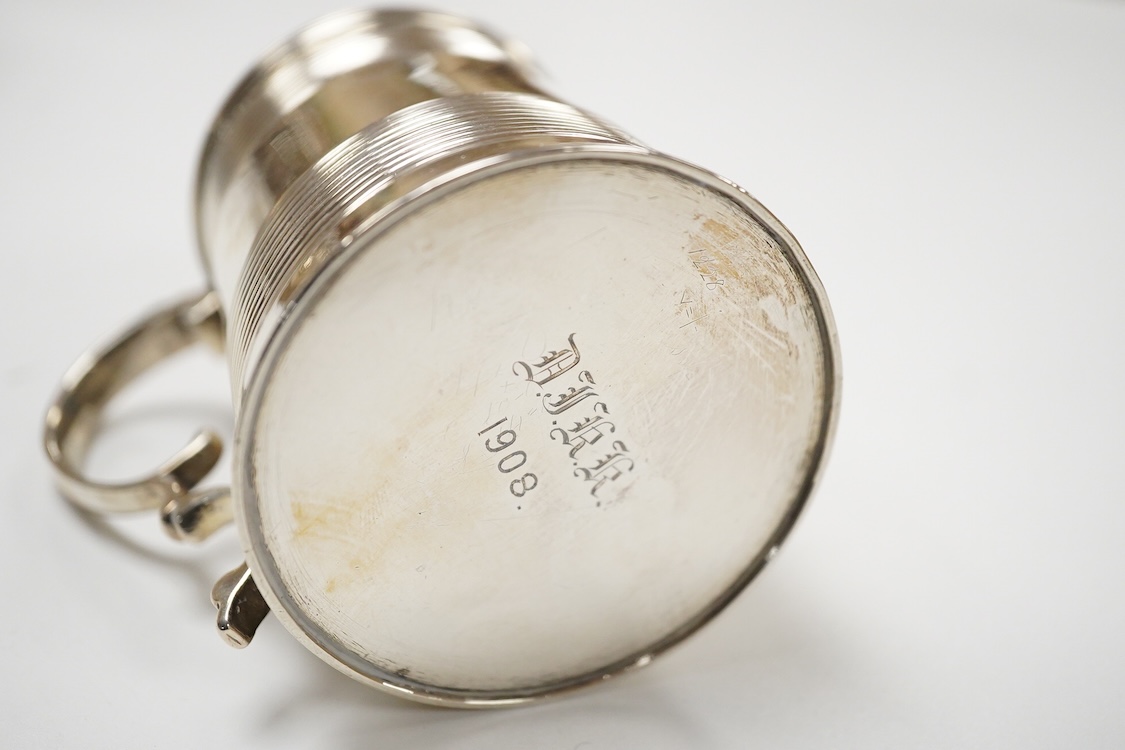 A William IV reeded silver christening mug, with later engraved initials and date to the base, Joseph Angell I & John Angell I, London, 1834, height 77mm, 3.9oz.